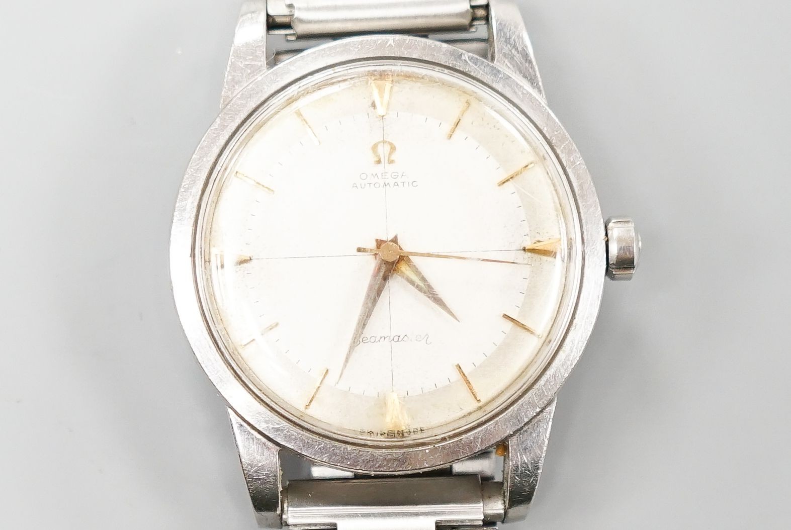 A gentleman's late 1950's stainless steel Omega Seamaster automatic wrist watch, on associated steel bracelet, movement c.501, no box or papers, cased diameter 36mm.